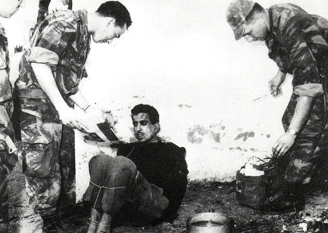 French paratroopers torturing a prisoner from the Algerian Liberation Front. Image; Saber68
