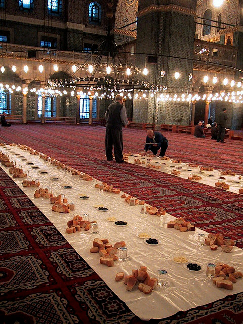 A communal iftar is set up in an Istanbul mosque. By: Balavenise.