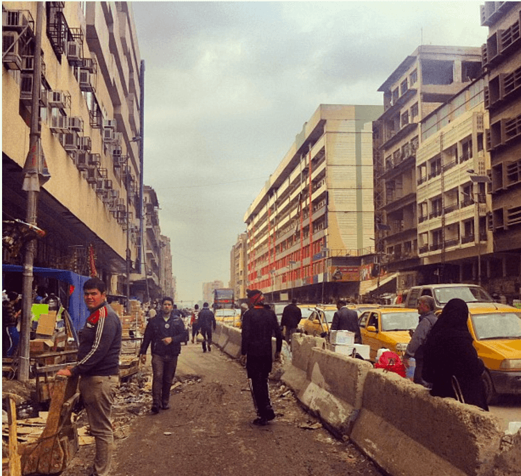 Road blocks divide Al Jamhouriya St, Baghdad (2012).